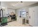 Well-lit kitchen featuring modern appliances, ample cabinetry, and a functional layout at 6592 S Cody Way, Littleton, CO 80123