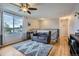 Cozy upstairs living area with hardwood floors, a comfortable couch, and bright natural light at 6592 S Cody Way, Littleton, CO 80123