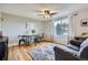 Inviting living area with hardwood floors, large window, and stylish decor, perfect for relaxation at 6592 S Cody Way, Littleton, CO 80123