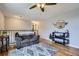 Upstairs living area featuring hardwood floors, comfortable seating, and stylish decor at 6592 S Cody Way, Littleton, CO 80123