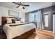 Comfortable main bedroom with natural light, stylish decor, and hardwood floors, perfect for relaxation at 6592 S Cody Way, Littleton, CO 80123