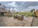 An outdoor patio is arranged with stylish furniture and string lights, creating a cozy space in the backyard at 6592 S Cody Way, Littleton, CO 80123