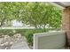 Covered condo porch with trees and greenspace creating a peaceful and private setting at 10129 W 55Th Dr # 3, Arvada, CO 80002