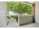 View from a condo patio with a green lawn and trees in the background at 10129 W 55Th Dr # 3, Arvada, CO 80002