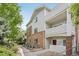 Attractive condo building with brick and siding exterior, balconies, and landscaping at 10129 W 55Th Dr # 3, Arvada, CO 80002