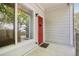 Inviting condo entrance with a red door and sidelight window at 10129 W 55Th Dr # 3, Arvada, CO 80002