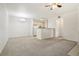 Open-concept living room and kitchen with neutral carpet at 10129 W 55Th Dr # 3, Arvada, CO 80002