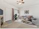 Staged living room with comfortable seating, a fireplace, and ample space at 10129 W 55Th Dr # 3, Arvada, CO 80002