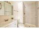 Modern bathroom features a tiled shower, updated vanity, and bright lighting at 4182 S Joplin St, Aurora, CO 80013