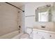 Bright bathroom features updated shower, vanity, and stylish lighting at 4182 S Joplin St, Aurora, CO 80013