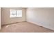 This bright bedroom offers natural light from the window and neutral carpet at 4182 S Joplin St, Aurora, CO 80013