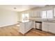 Bright and airy kitchen with stainless steel appliances, stone countertops, and white cabinets at 4182 S Joplin St, Aurora, CO 80013