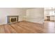 Bright living room with hardwood floors, gray fireplace and white staircase leading up to the second floor at 4182 S Joplin St, Aurora, CO 80013