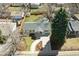 Aerial view of home showing landscaped front yard, backyard, and driveway at 1430 S Glencoe St, Denver, CO 80222