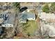 An aerial view of a backyard with lawn, a privacy fence, and patio area at 1430 S Glencoe St, Denver, CO 80222