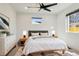 Spacious bedroom featuring hardwood floors, a ceiling fan, and lots of natural light at 1430 S Glencoe St, Denver, CO 80222