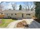 Charming single-story home with a well-maintained front yard and inviting walkway to the front door at 1430 S Glencoe St, Denver, CO 80222