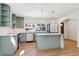 Modern kitchen with stainless appliances, a center island, and updated cabinetry at 1430 S Glencoe St, Denver, CO 80222