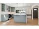 Modern kitchen features sleek appliances, stylish cabinetry, a center island, and ample counter space at 1430 S Glencoe St, Denver, CO 80222