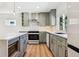 Stylish kitchen with updated appliances, sleek countertops, and ample storage space in modern cabinetry at 1430 S Glencoe St, Denver, CO 80222