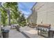 Outdoor deck with grill, dining table, and ample seating, ideal for gatherings at 1540 W Briarwood Ave, Littleton, CO 80120