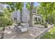 Paver patio with lounge chairs and a grill, perfect for outdoor entertaining at 1540 W Briarwood Ave, Littleton, CO 80120