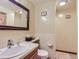 Cozy bathroom featuring a neutral palette, vanity sink, and walk-in shower at 1540 W Briarwood Ave, Littleton, CO 80120