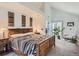 Bright and airy bedroom with vaulted ceilings and access to a private patio at 1540 W Briarwood Ave, Littleton, CO 80120
