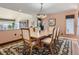 Inviting dining room with decorative chandelier and view of the outdoor landscape at 1540 W Briarwood Ave, Littleton, CO 80120