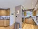 Bright, modern kitchen with stainless steel appliances and hardwood flooring at 1540 W Briarwood Ave, Littleton, CO 80120
