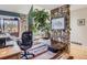 Inviting office with stone accents and view of the outdoor landscape at 1540 W Briarwood Ave, Littleton, CO 80120
