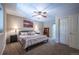 Bedroom with plush carpet, ceiling fan, and warm neutral paint tones at 1030 Timbercrest Dr, Castle Pines, CO 80108