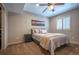 Bedroom features neutral colors, carpet, ceiling fan, and shuttered window at 1030 Timbercrest Dr, Castle Pines, CO 80108