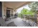 Covered deck with ample seating and a stainless steel gas grill at 1030 Timbercrest Dr, Castle Pines, CO 80108