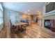 Open kitchen and dining area featuring granite counters, custom cabinets, and fireplace at 1030 Timbercrest Dr, Castle Pines, CO 80108
