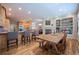 Lovely kitchen and dining area, granite counters, custom cabinets, and fireplace at 1030 Timbercrest Dr, Castle Pines, CO 80108