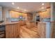 Modern kitchen with custom cabinets, stainless steel appliances, and center island at 1030 Timbercrest Dr, Castle Pines, CO 80108