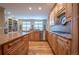 Spacious kitchen featuring custom cabinets, hardwood floors, and stainless steel appliances at 1030 Timbercrest Dr, Castle Pines, CO 80108