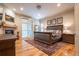 Inviting main bedroom with hardwood floors, fireplace, and plenty of natural light at 1030 Timbercrest Dr, Castle Pines, CO 80108