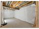 Unfinished basement with concrete floors and exposed ceiling, ready to be customized at 15501 E 112Th Ave # 6F, Commerce City, CO 80022