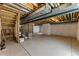 Unfinished basement with high ceilings, exposed ductwork, and concrete flooring offering possibilities at 15501 E 112Th Ave # 6F, Commerce City, CO 80022