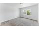 Bright bedroom with carpeted floors and two large windows at 15501 E 112Th Ave # 6F, Commerce City, CO 80022
