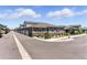Charming townhomes with neutral siding, rock facade, and beautifully landscaped grounds at 15501 E 112Th Ave # 6F, Commerce City, CO 80022