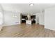 Spacious living room and kitchen featuring an open layout, hardwood floors, and modern amenities at 15501 E 112Th Ave # 6F, Commerce City, CO 80022