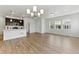 Bright open living space with hardwood floors and large windows, creating an inviting atmosphere at 15501 E 112Th Ave # 6F, Commerce City, CO 80022