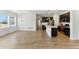 Open floorplan with modern kitchen seamlessly flowing into the living area, ideal for entertaining at 15501 E 112Th Ave # 6F, Commerce City, CO 80022