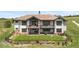Backyard featuring multiple patios, manicured lawn, and a hot tub at 8625 Eagle Moon Way, Parker, CO 80134