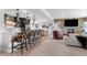 Finished basement features a bar, a fireplace, and ample seating for entertaining at 8625 Eagle Moon Way, Parker, CO 80134