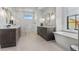 Bright bathroom with a soaking tub, glass enclosed shower, and double vanity sinks at 8625 Eagle Moon Way, Parker, CO 80134