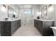 Elegant bathroom featuring double vanities, a walk-in shower, and luxurious finishes at 8625 Eagle Moon Way, Parker, CO 80134